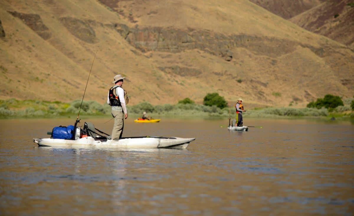 Men standing in the best standup fishing kayaks