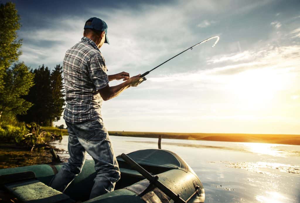 man fishing from the kayak