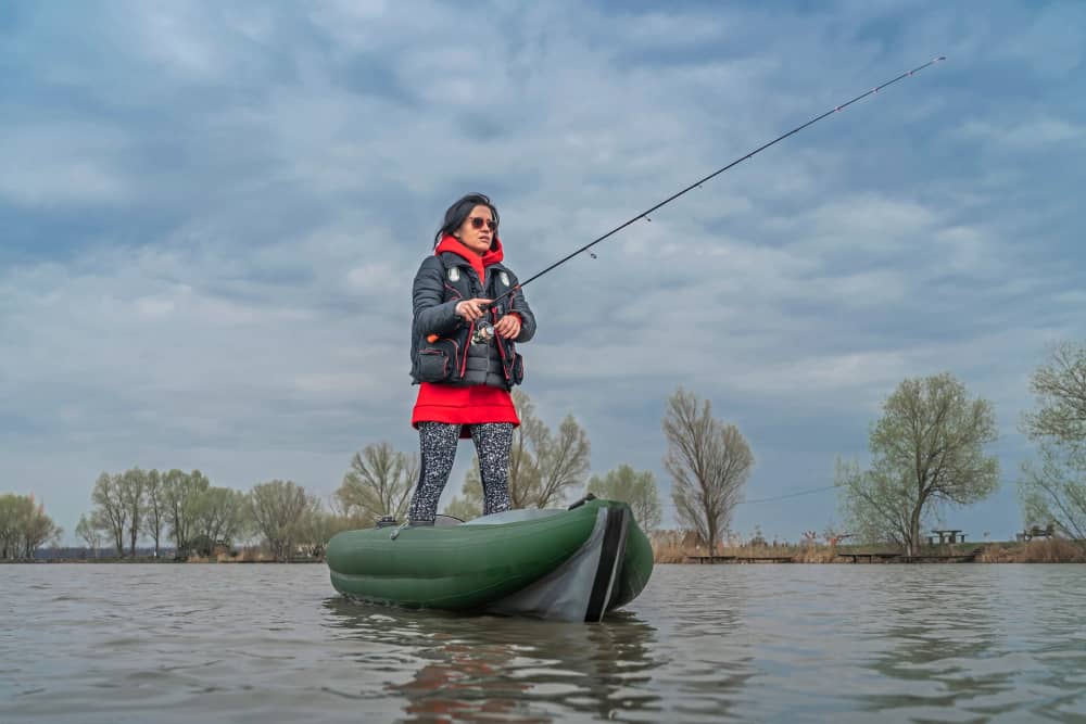 Lady In stand up fishing kayak