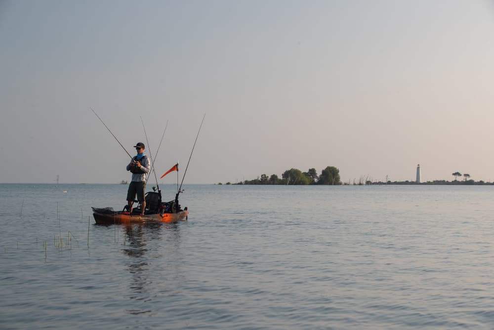 Man in stand up fishing kayak