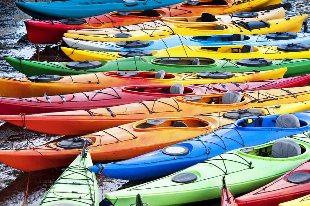 Collection of coloured small kayaks