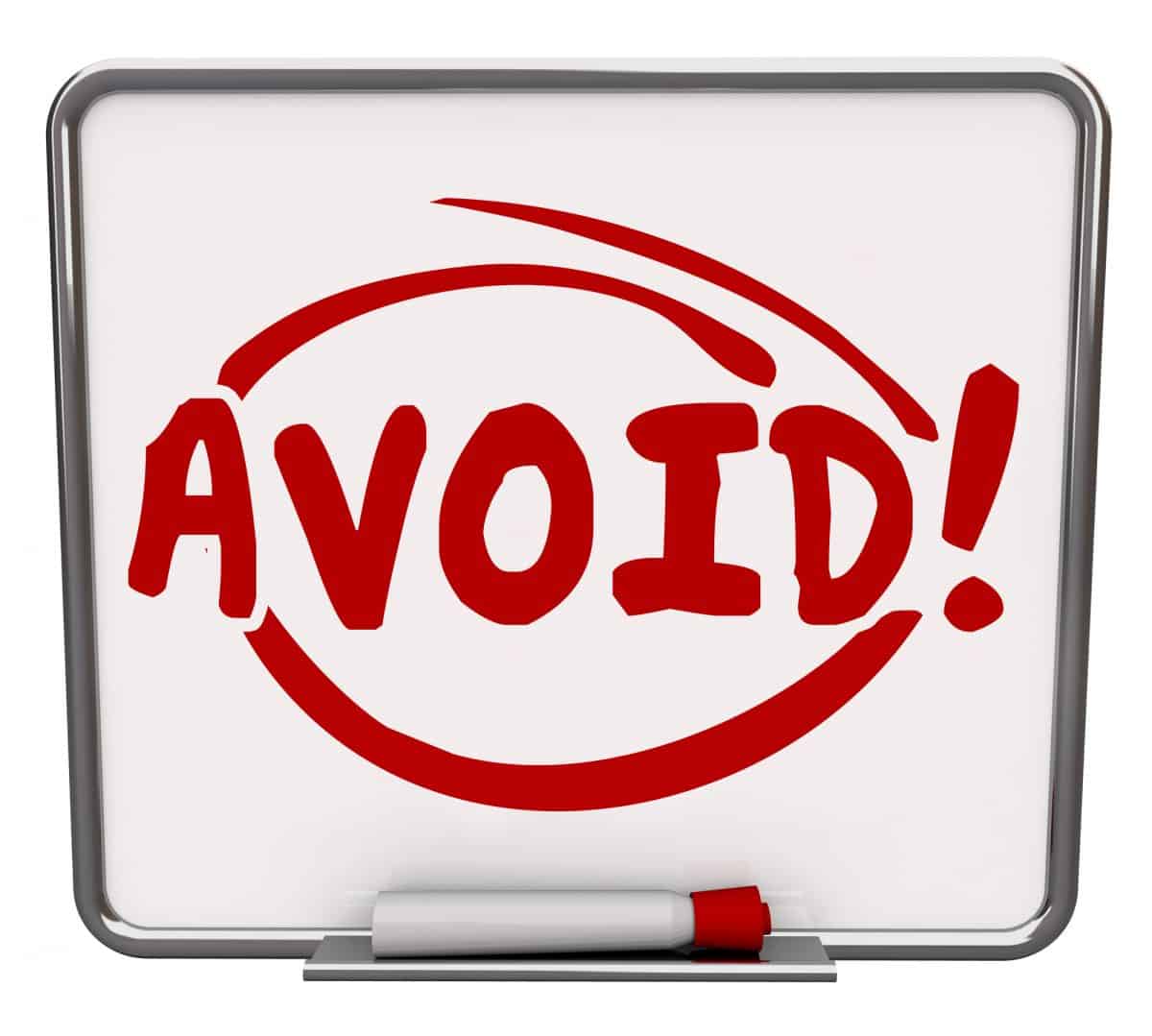 Avoid word written and circled on a dry erase board to illustrate a warning or danger sign of things to prevent as a precaution for safety and security