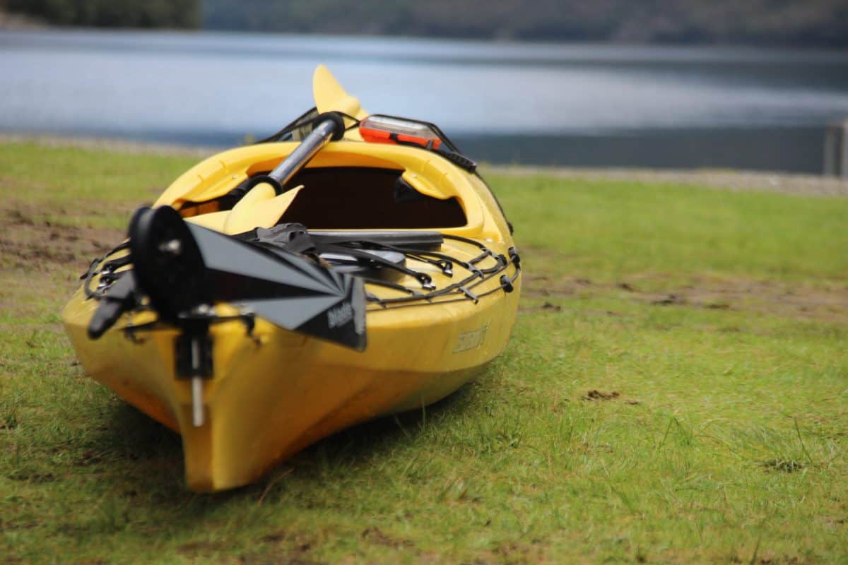 Dirty Kayak laying by the river