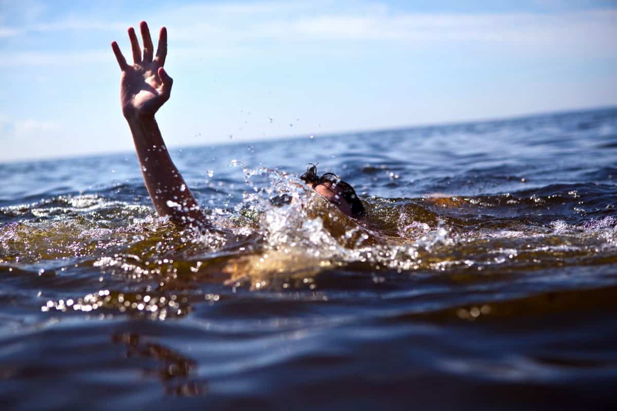 kayaking risk of Drowning - man struggles in water