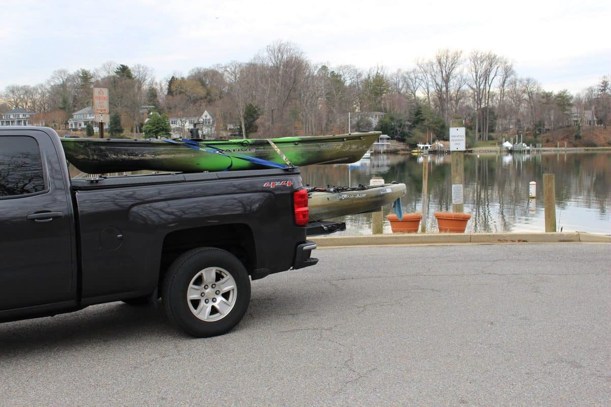 kayaking being transported in the bed of a truck