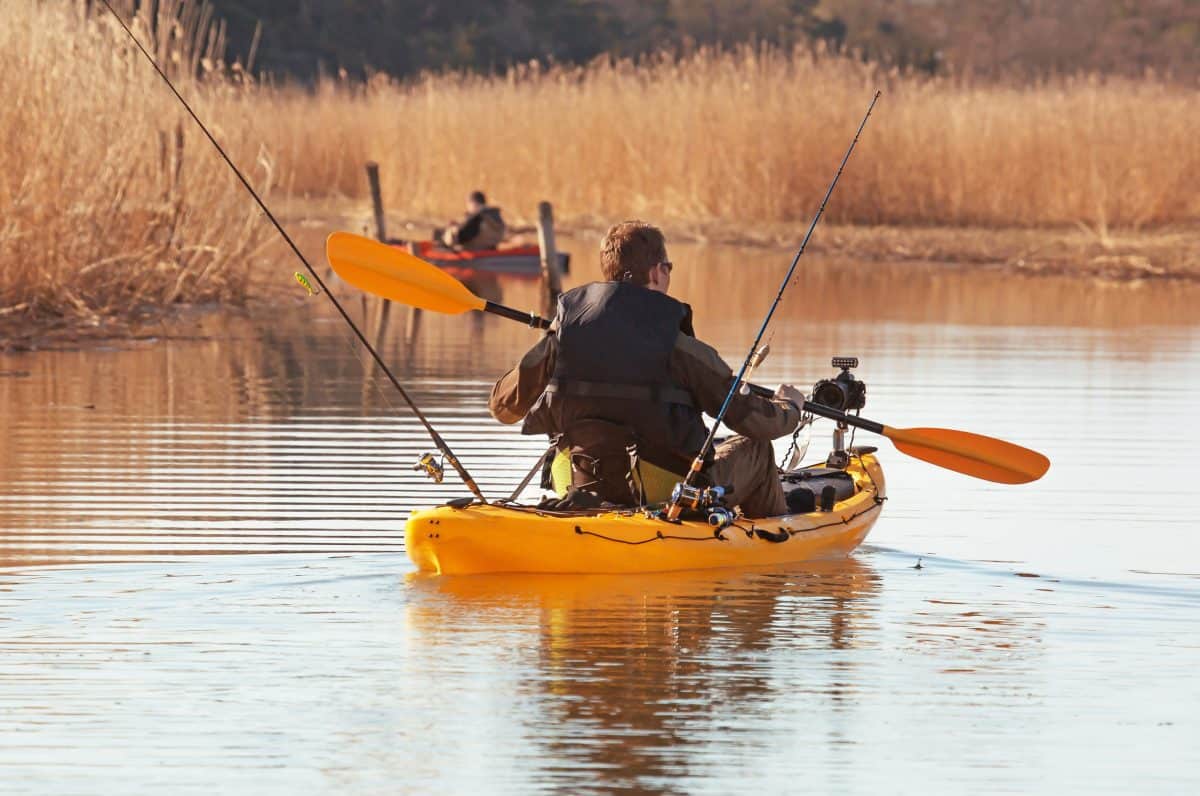 Recreational fishermen in small kayak.