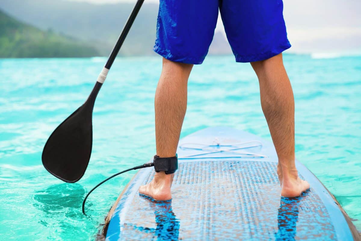 Closeup man standing on epoxy board