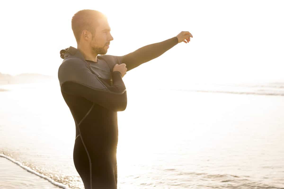 Surfer getting ready for surf at beach